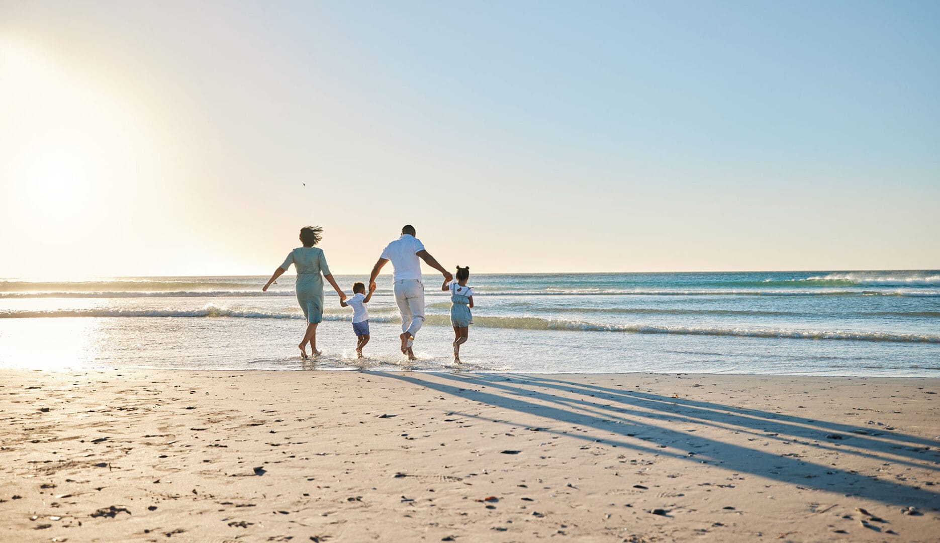 Family on the Beach in the Summer Holidays